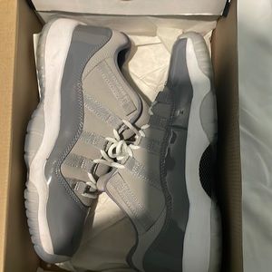 Gray and white kids jordans in good condition.